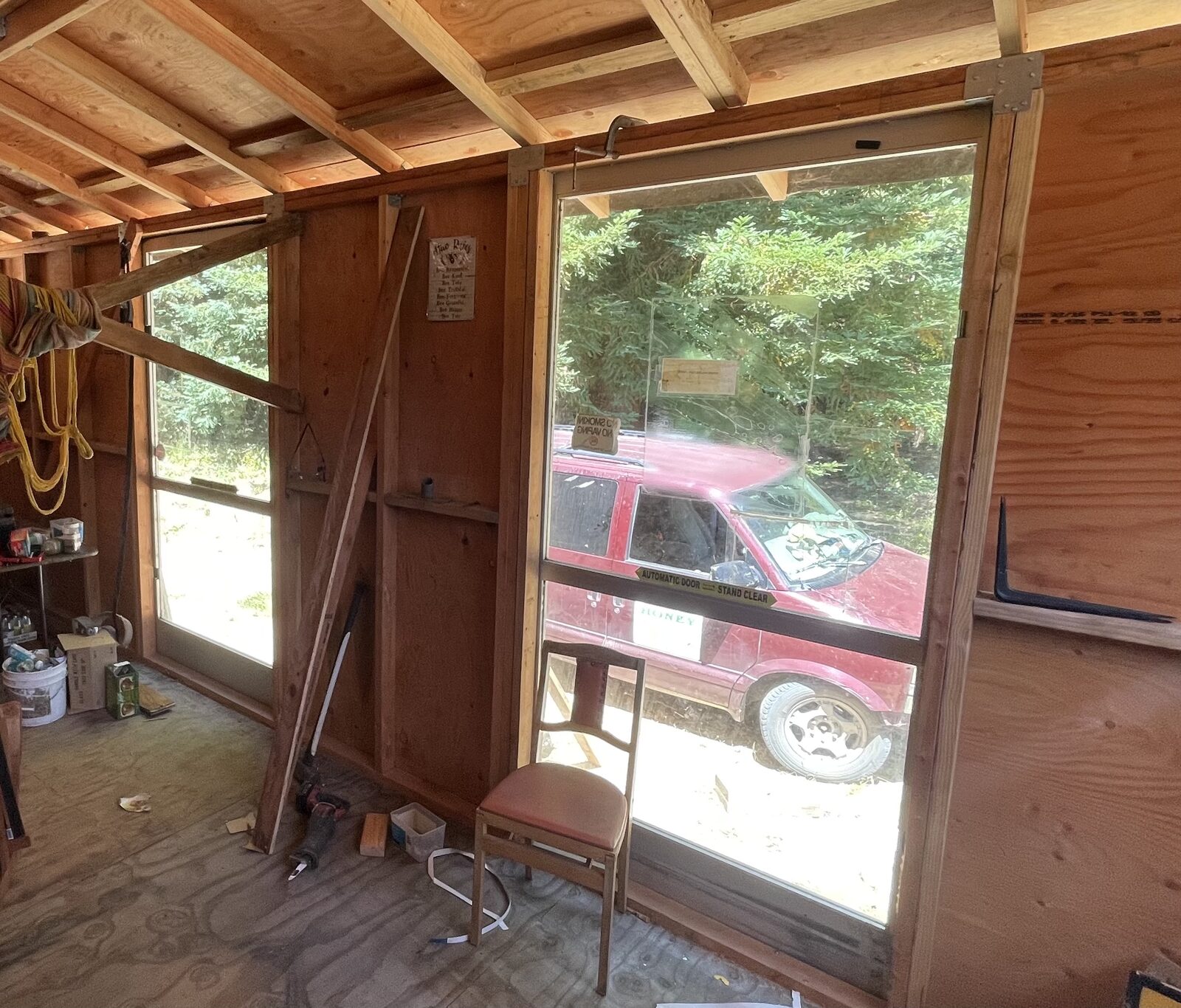 Inside the stand looking out through a newly installed full-height glass window